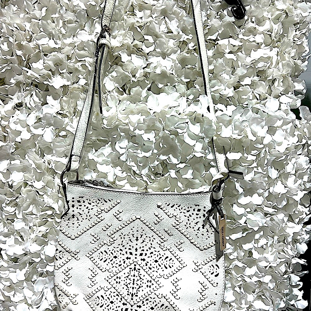 New purses by Coco & Carmen with a protective bag covering pull string